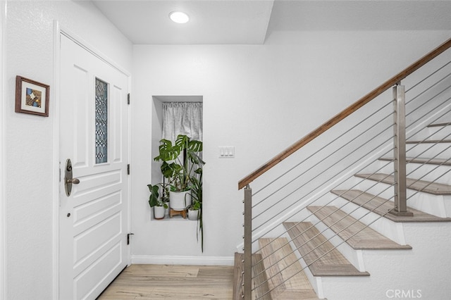 entryway with light hardwood / wood-style flooring