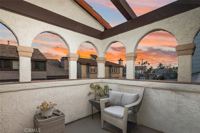 view of balcony at dusk