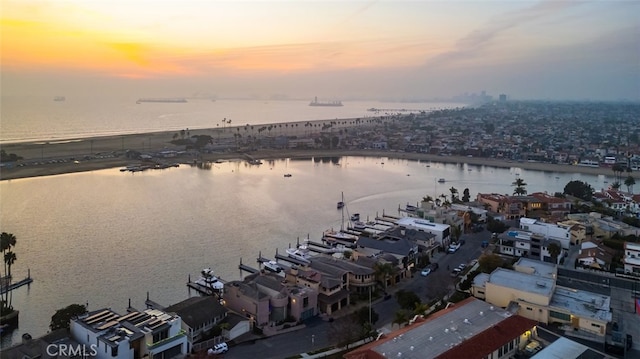 aerial view at dusk with a water view