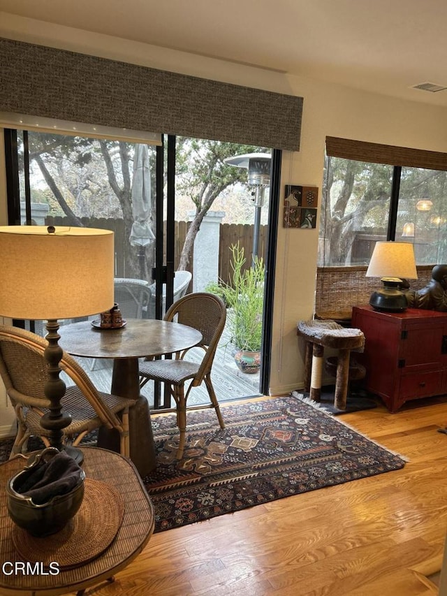 interior space featuring a healthy amount of sunlight and hardwood / wood-style floors