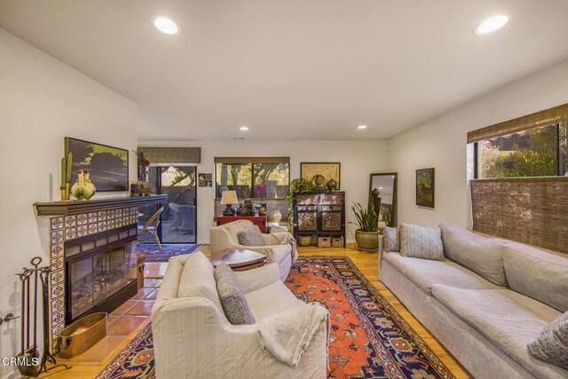 living room with a textured ceiling and hardwood / wood-style flooring