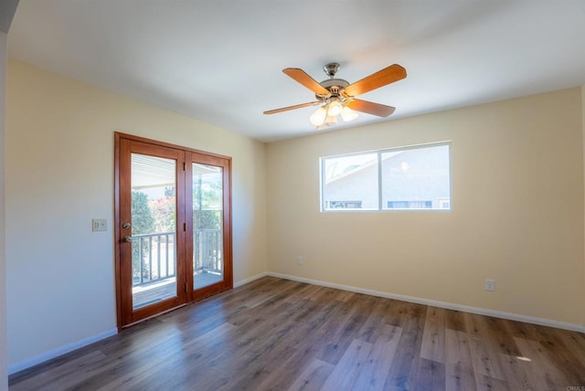 spare room featuring ceiling fan and dark hardwood / wood-style flooring