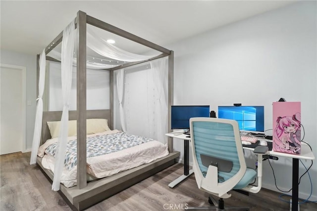 bedroom featuring wood-type flooring