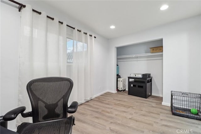 office with light wood-type flooring