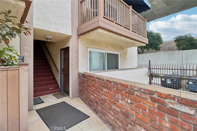 property entrance with a balcony