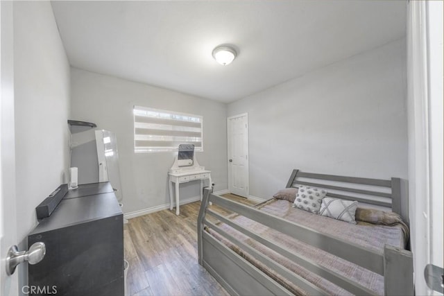 bedroom featuring hardwood / wood-style flooring