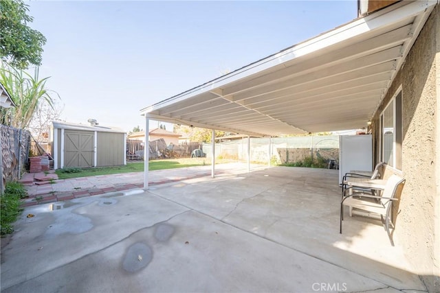 view of patio featuring a storage unit