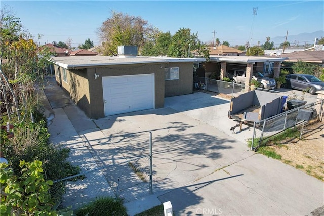 ranch-style home featuring a garage