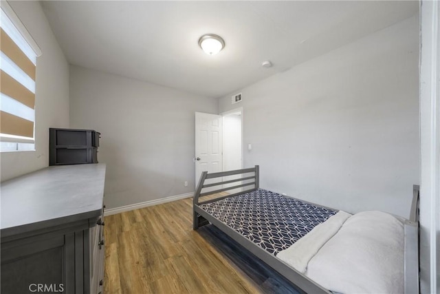 bedroom featuring hardwood / wood-style floors