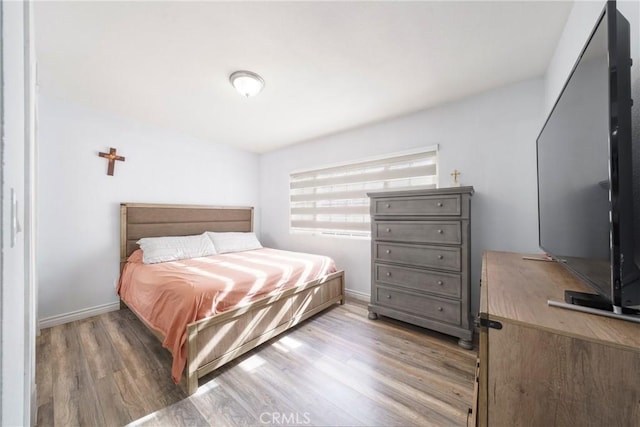 bedroom featuring dark hardwood / wood-style flooring