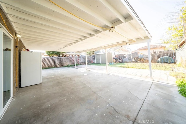 view of patio / terrace with a storage unit