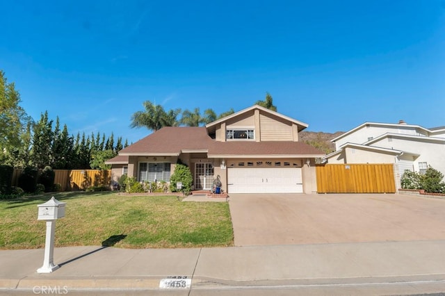 front of property featuring a garage and a front yard