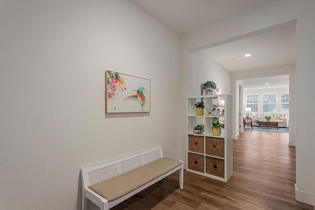 hall with hardwood / wood-style flooring