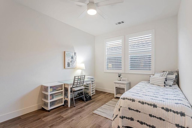 bedroom featuring hardwood / wood-style flooring and ceiling fan