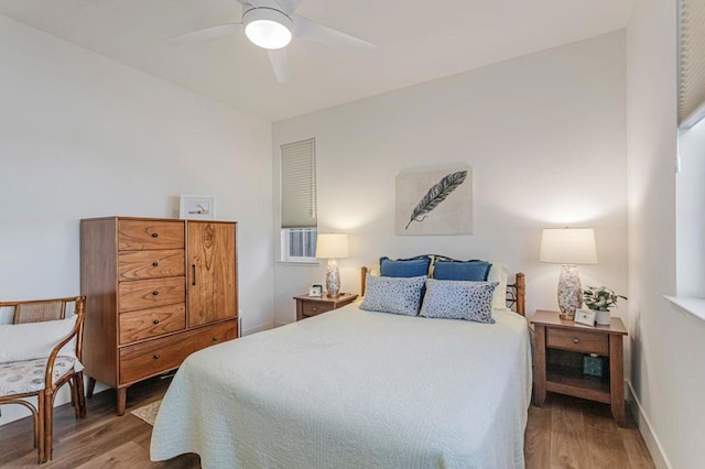 bedroom featuring hardwood / wood-style flooring and ceiling fan