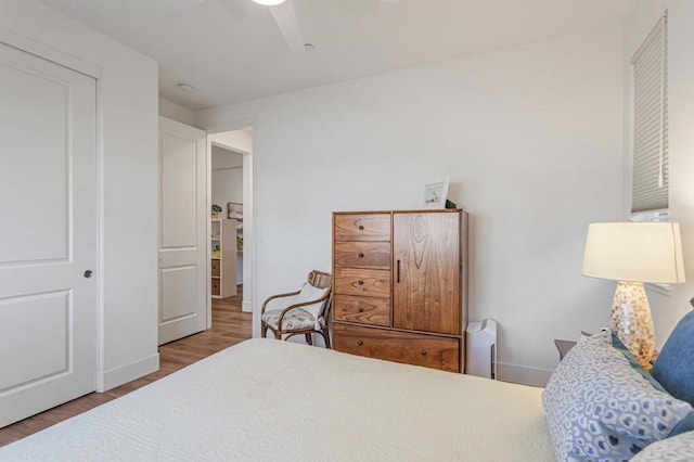 bedroom featuring wood-type flooring and ceiling fan