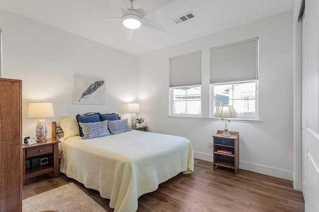 bedroom with ceiling fan and hardwood / wood-style floors