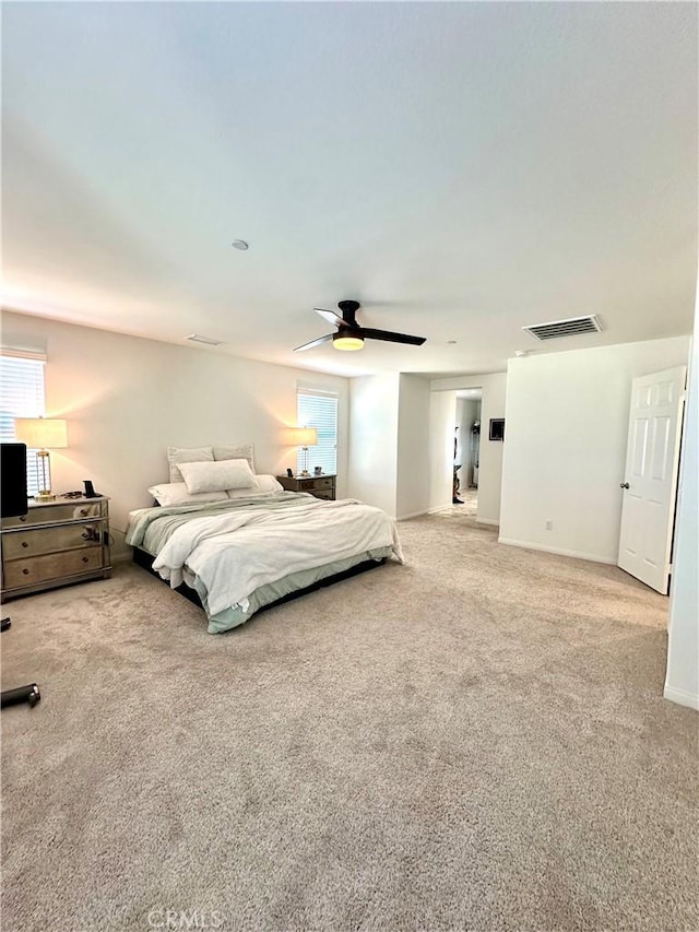 unfurnished bedroom featuring ceiling fan and carpet floors