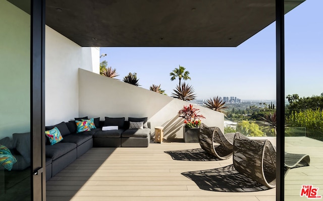 wooden deck with outdoor lounge area