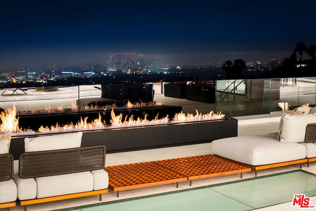 exterior space featuring an outdoor fire pit