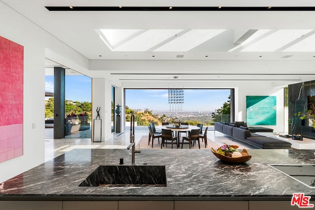 interior space featuring plenty of natural light, sink, and a chandelier