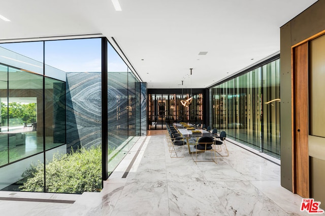 interior space with plenty of natural light and floor to ceiling windows