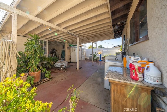 view of patio / terrace with washing machine and clothes dryer