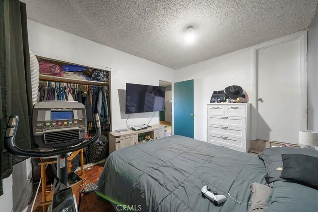 bedroom featuring a closet and a textured ceiling