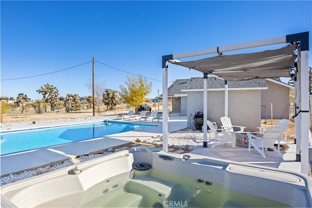 view of pool with an outdoor hot tub and a patio