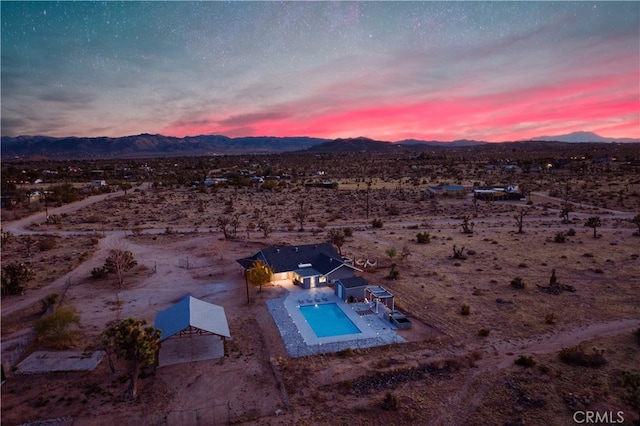 aerial view at dusk with a mountain view