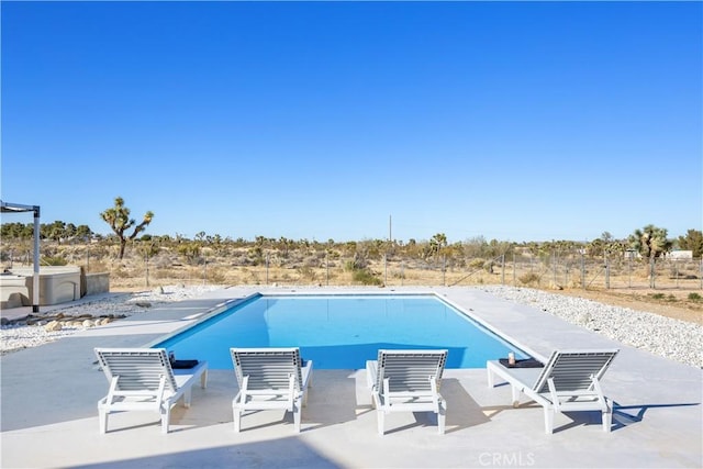 view of swimming pool featuring a patio