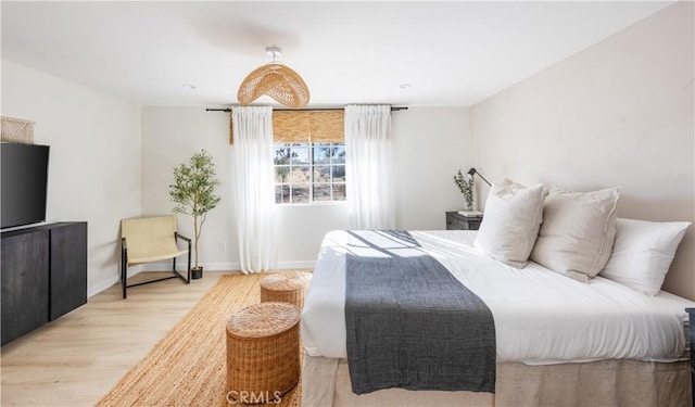 bedroom with light wood-type flooring