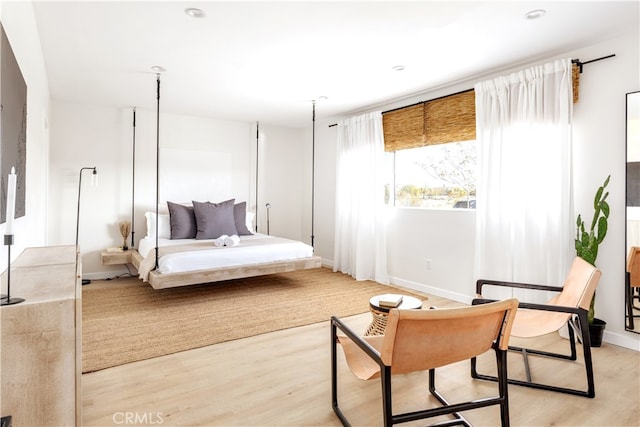 bedroom with light hardwood / wood-style flooring