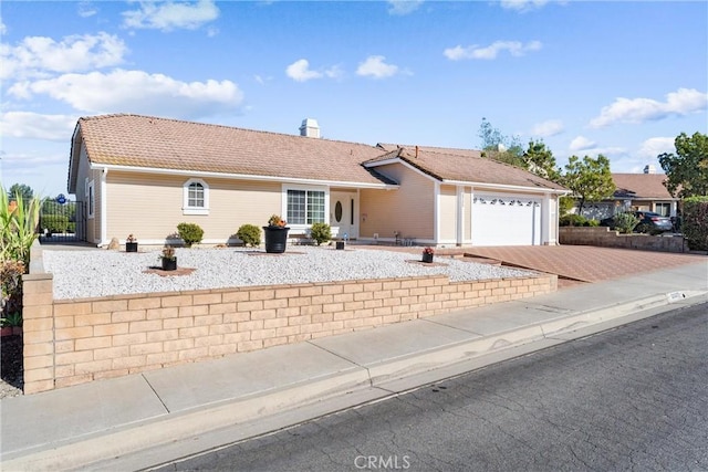 ranch-style home with a garage