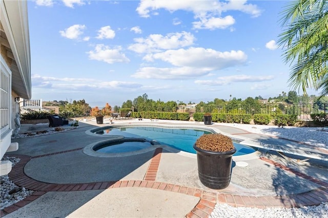 view of pool featuring an in ground hot tub and a patio area