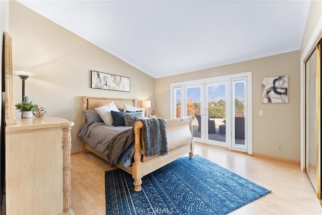 bedroom with light wood-type flooring, access to exterior, french doors, and lofted ceiling