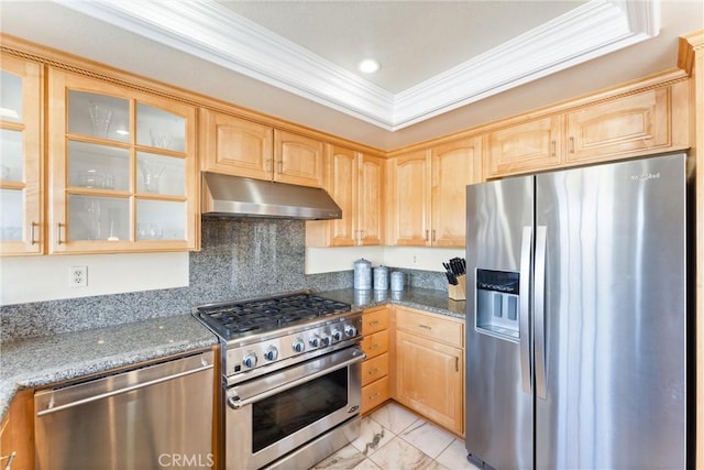 kitchen featuring light brown cabinets, appliances with stainless steel finishes, dark stone counters, and crown molding