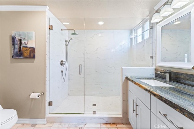 bathroom with vanity, toilet, tile patterned flooring, and walk in shower