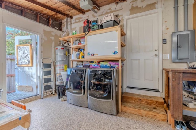 clothes washing area featuring carpet flooring, washer and dryer, secured water heater, and electric panel