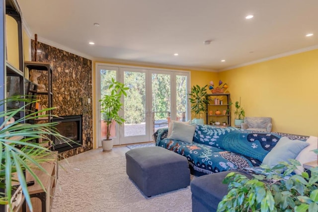 living room featuring ornamental molding and a fireplace