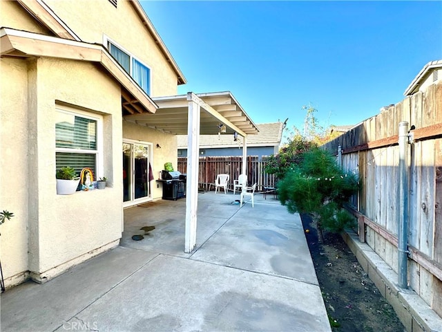 view of patio featuring a grill