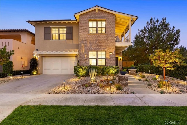 view of front property featuring a garage and a balcony