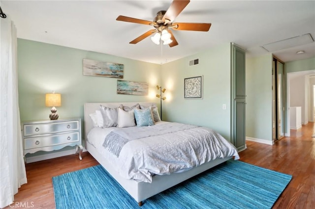 bedroom featuring hardwood / wood-style flooring and ceiling fan