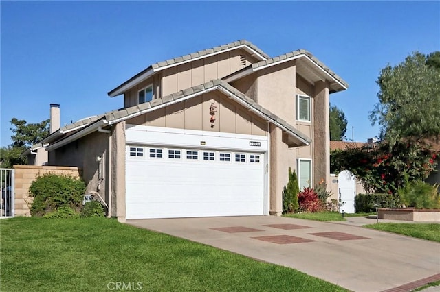 view of front of house featuring a garage and a front yard