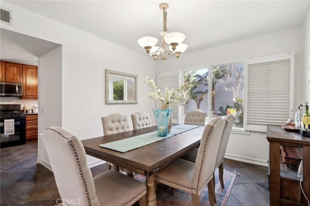 dining space featuring a chandelier