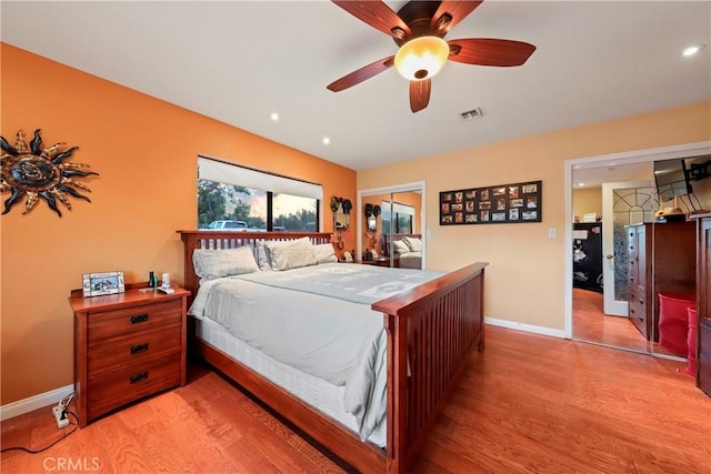 bedroom featuring light wood-type flooring, a closet, and ceiling fan