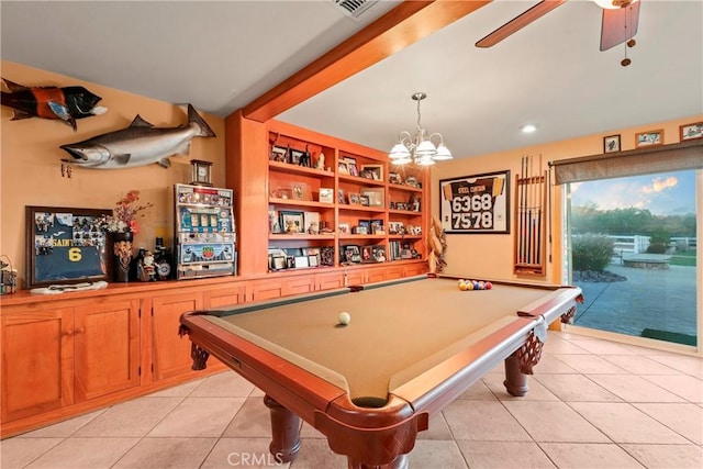 rec room with ceiling fan with notable chandelier, light tile patterned floors, billiards, and built in features