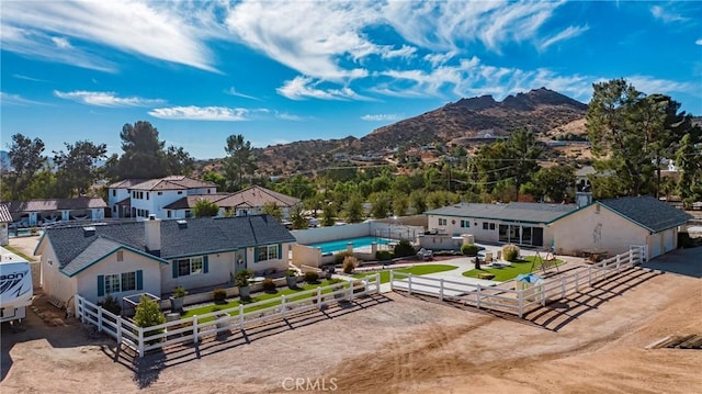 birds eye view of property featuring a mountain view