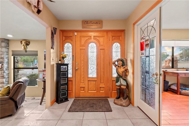 entrance foyer featuring light tile patterned floors