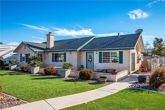 ranch-style house featuring a front lawn